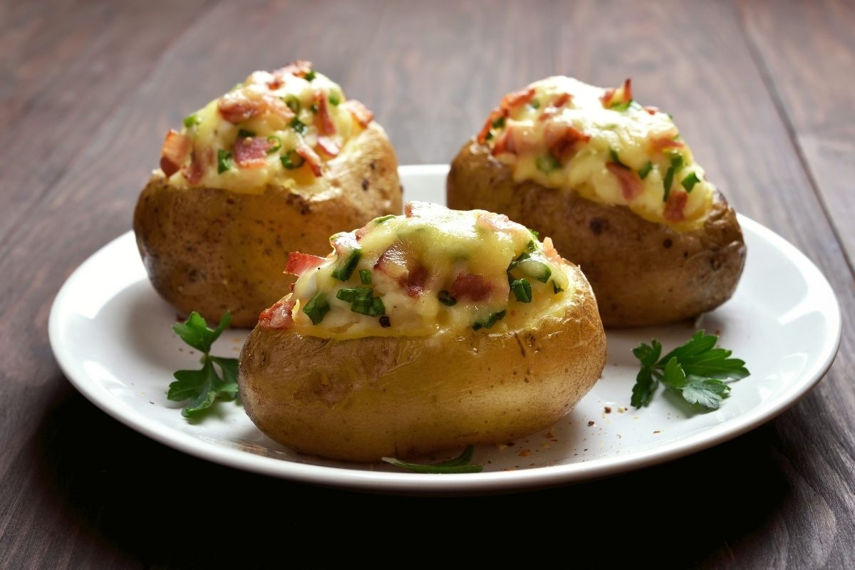 Twice baked potatoes with cheese, bacon and green onions.