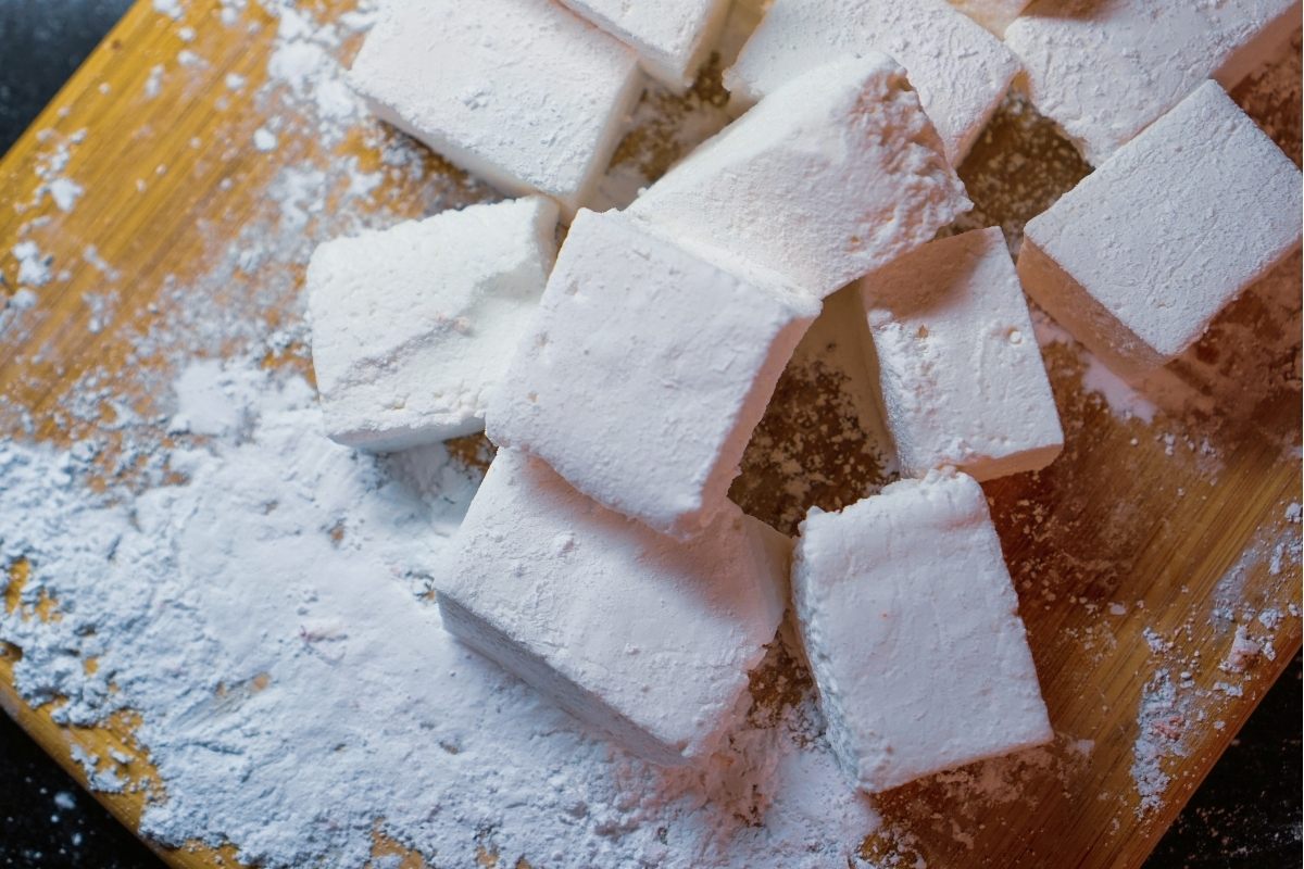 Homemade marshmallows on a board.
