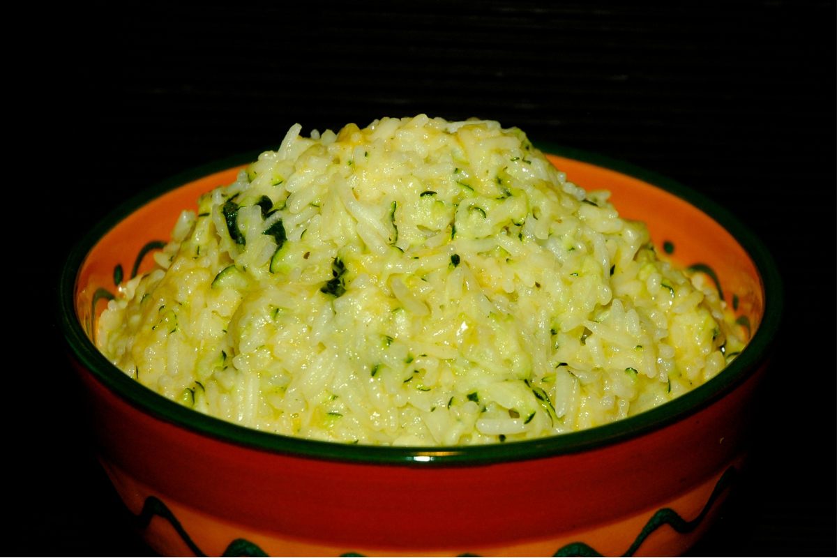 A bowl of cheesy zucchini rice.