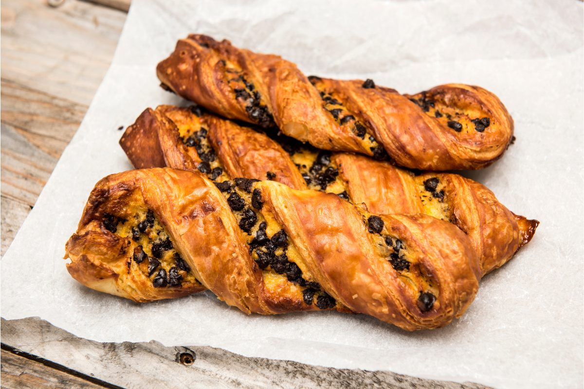 Three pastry twists with chocolate chips.