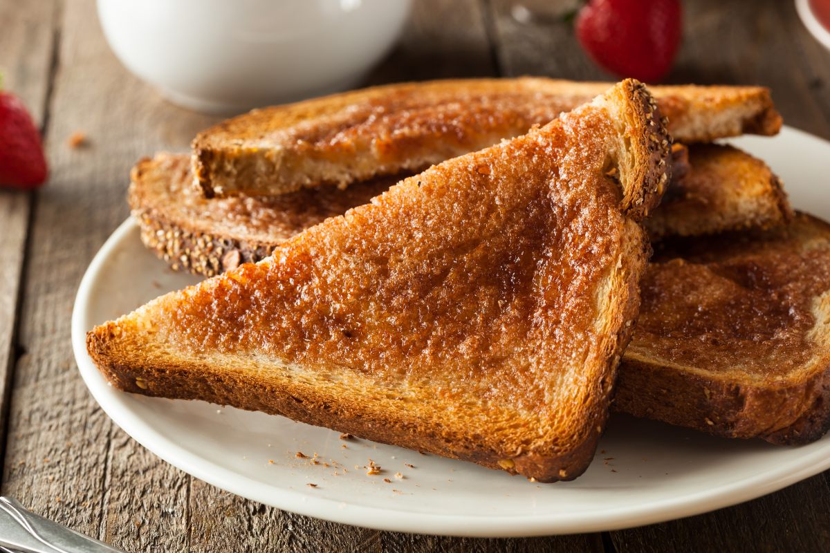 A plate with triangles of homemade sugar and cinnamon toast.