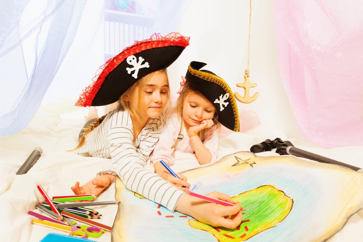 Two pirates drawing the treasure map.