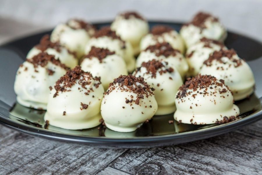 White chocolate truffles decorated with cacao.