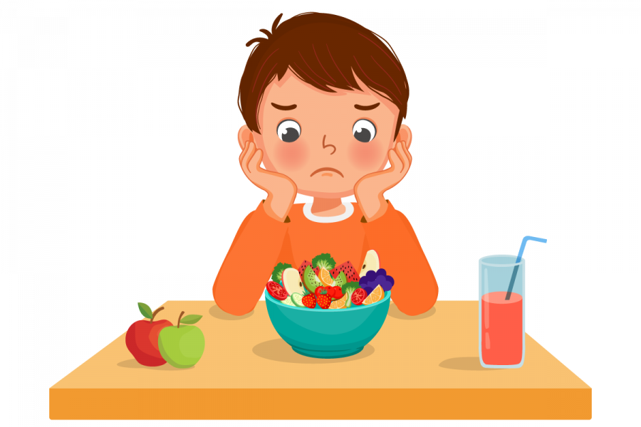 Little boy picky eater feeling unhappy looking at bowl of fruits and vegetables with hands on the cheek.