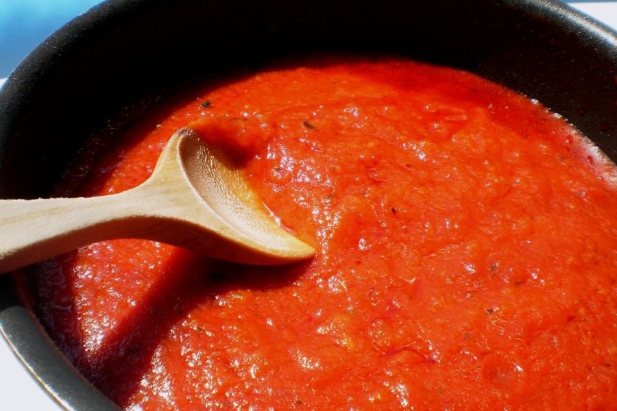 Tomato sauce cooking in a pan.