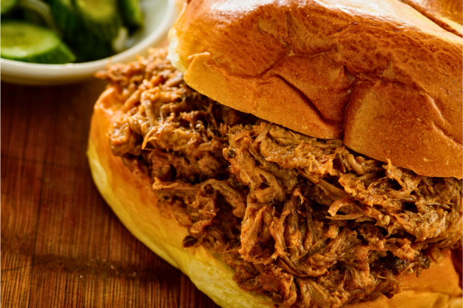 Detail of a pulled pork sandwich.